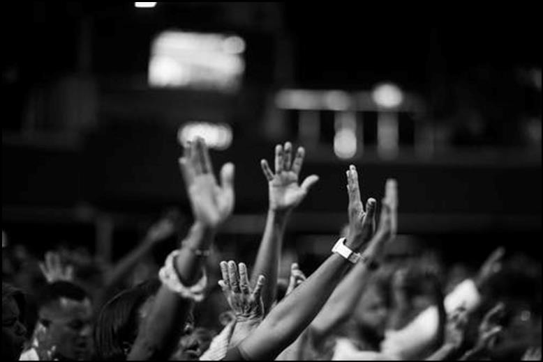 Grayscale Photography of People Raising Hands